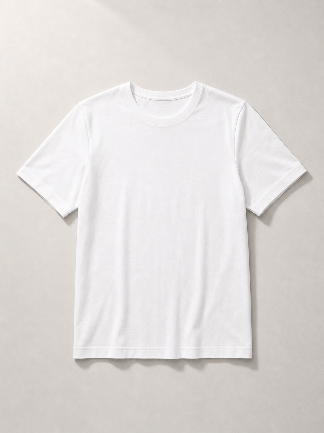 UOMO VIANA Essential White Tee on a pale stone background