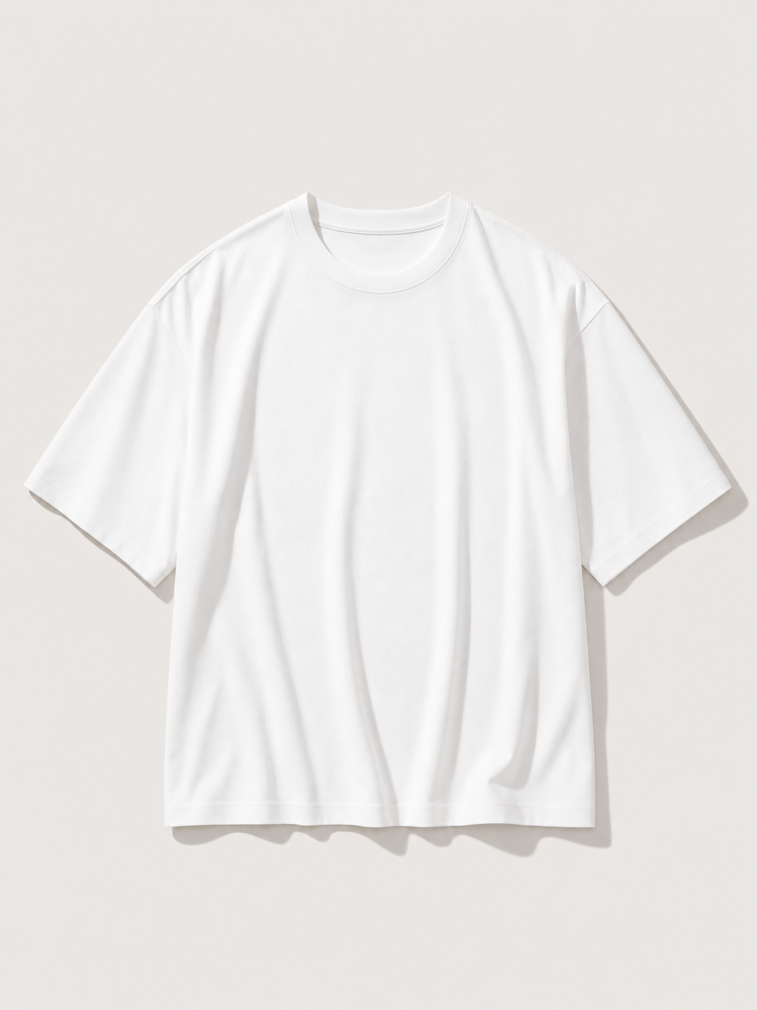 UOMO VIANA Relaxed White Tee on a pale stone background