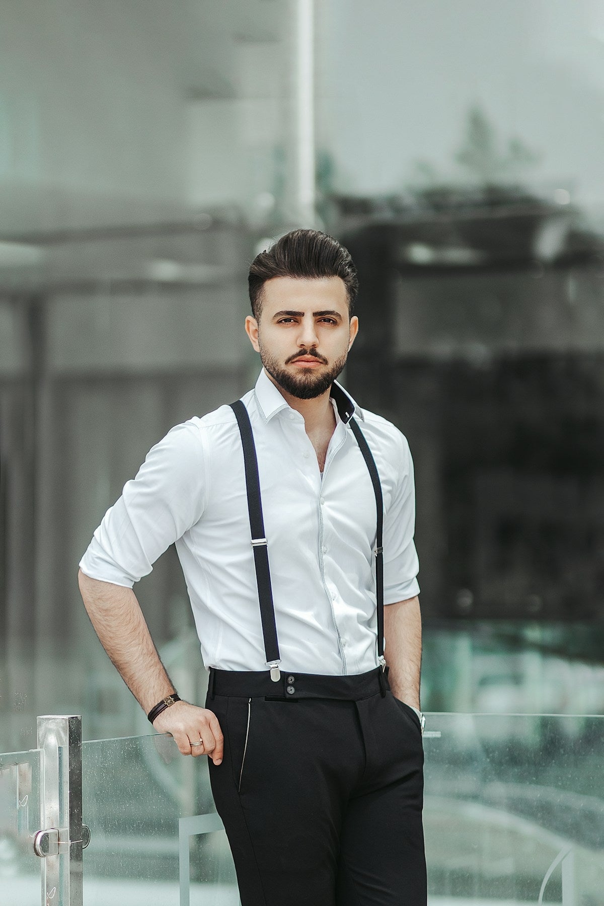 Crisp white shirt with black suspenders